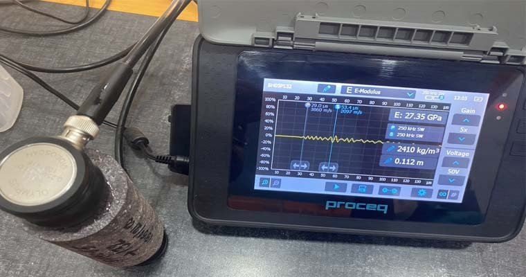 Engineer carrying out a pile integrity test on a cast-in-situ pile