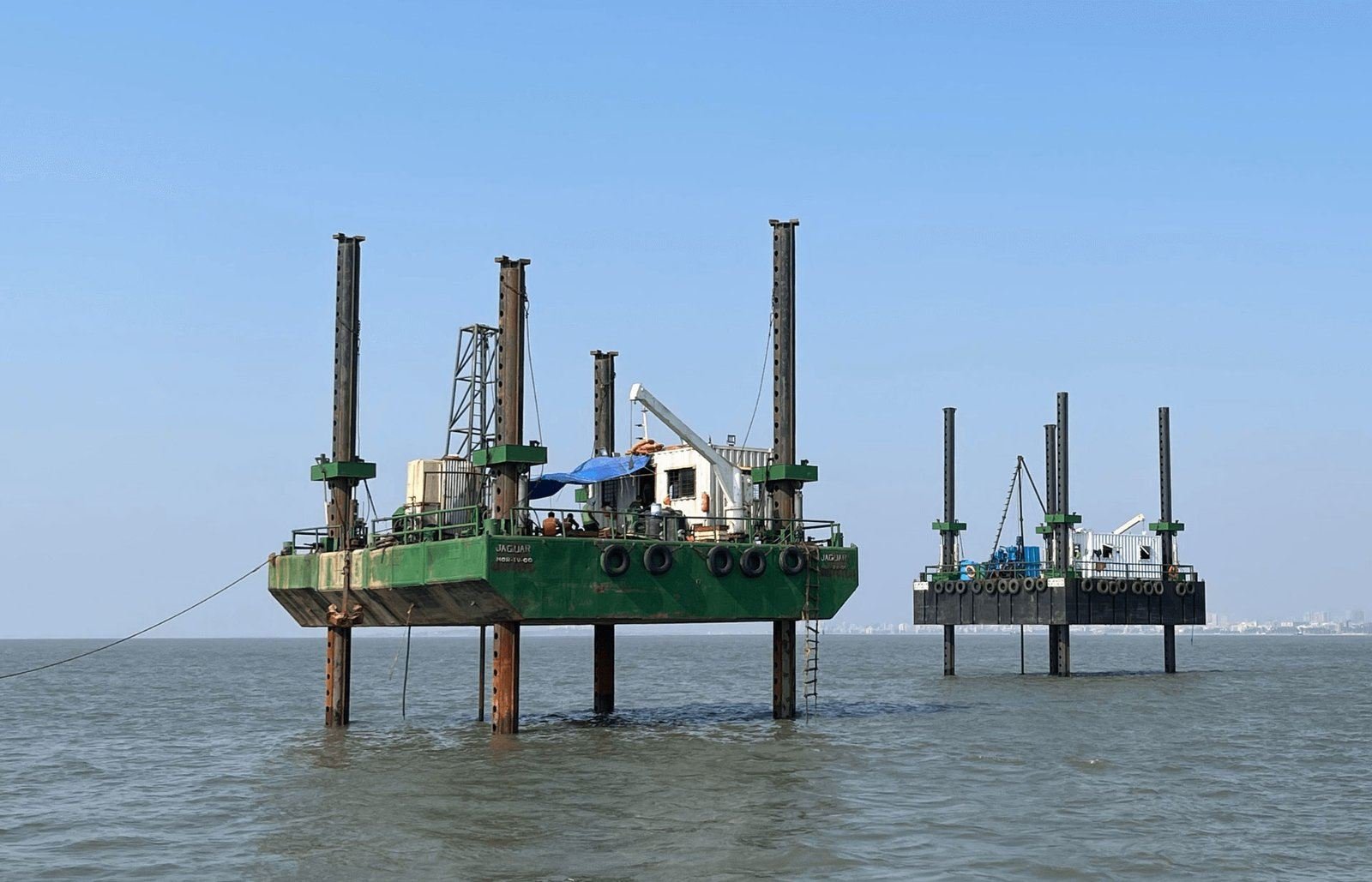 Jack-up barges carrying out offshore geotechnical investigation